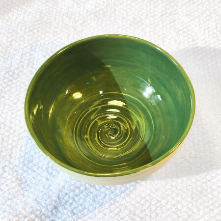 Clean Green Bowl $25.00 (5.5h x 14.5w) 1 in Stock Perfect for grazing boards or small serving options. Green satin glaze on the inside of the bowl.