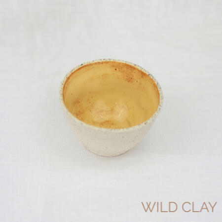 Small Nest Bowl | Butterscotch $22.00 | 1 available Wheel thrown white speckle bowl with a Butterscotch glaze interior.